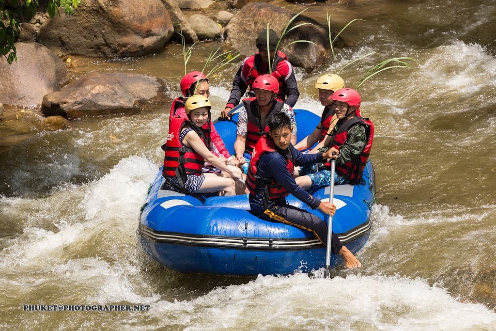 A raft crew driving through whitewater